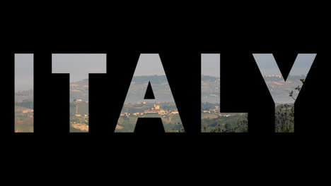 Aerial-Drone-Shot-Of-Villages-And-Mountains-In-Italy-With-Graphic-Spelling-Out-Italy